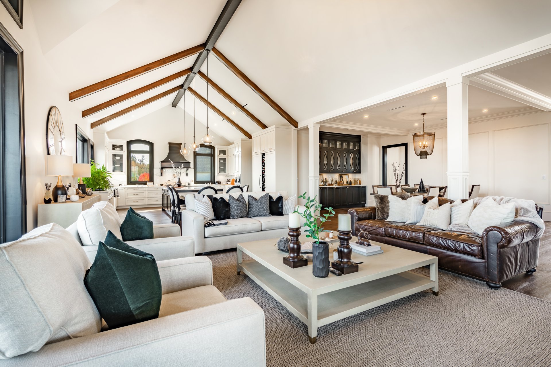 Luxury modern interior with black aluminum framed glass doors and dramatic lighting