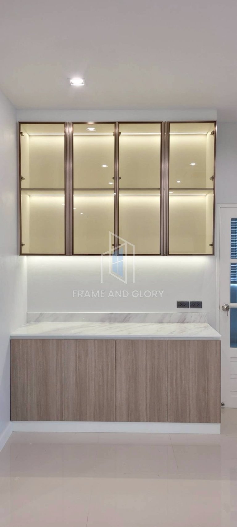 Modern bathroom vanity with lit mirrored cabinet and marble countertop, minimalist interior design