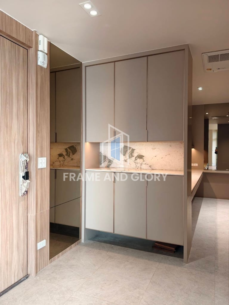 Modern bedroom closet with beige and white sliding doors, wood-grain accents, and decorative mirror panel in contemporary home interior