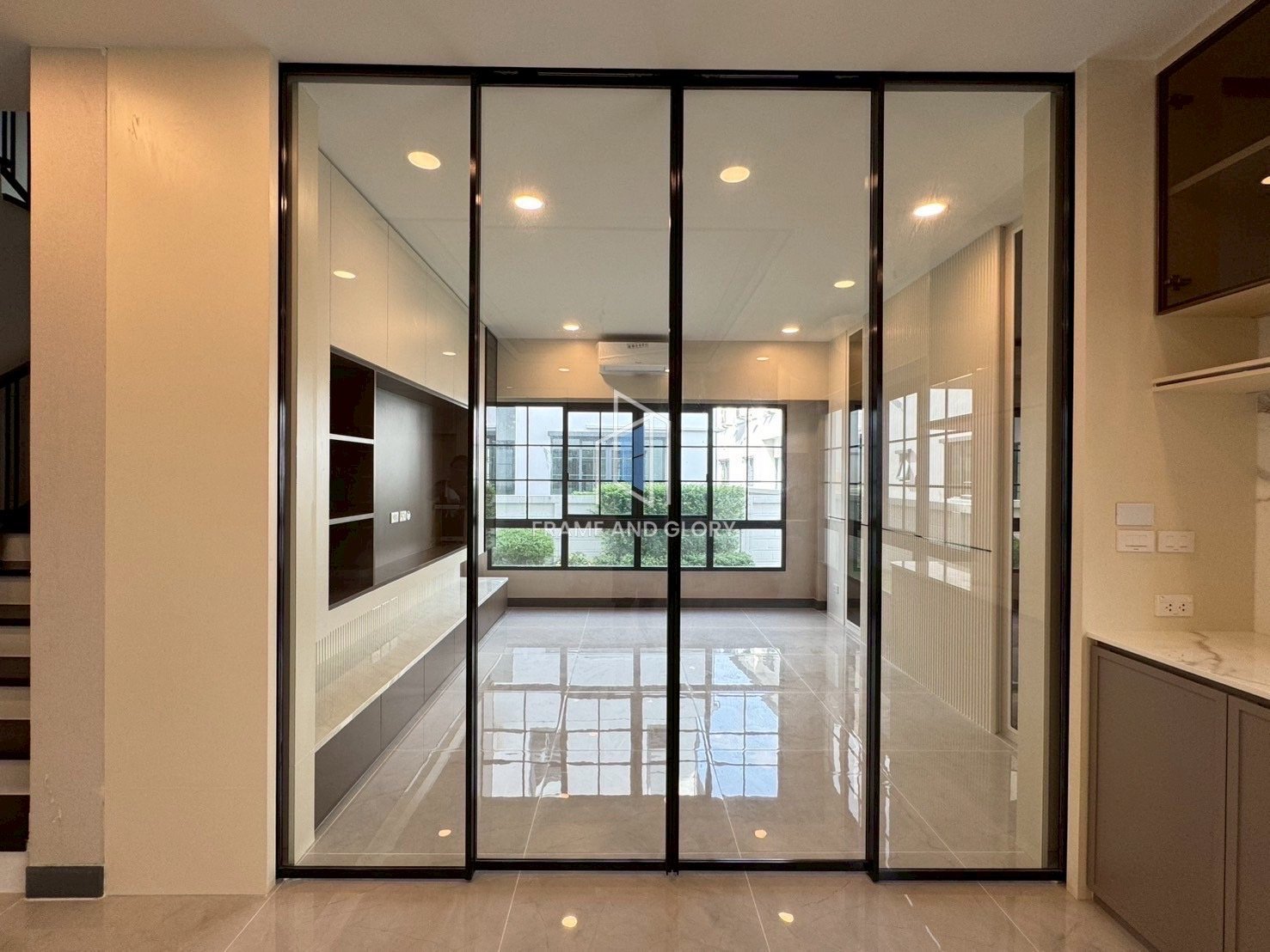 Modern glass partition door in bright living space